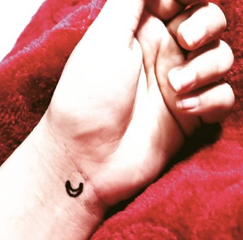 Tarjanee Bhadla featuring Moon tattoo on her left wrist