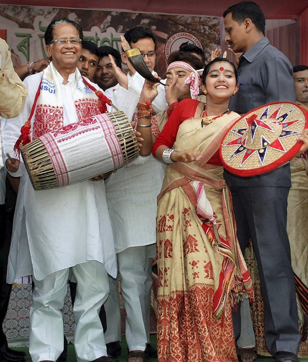 Tarun Gogoi plays the dhol during Sampriti Asom Utsav organised to mark the Rongali Bihu celebrations in Guwahati