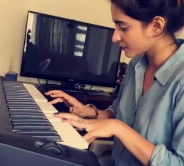 Tithi Raaj while playing a piano