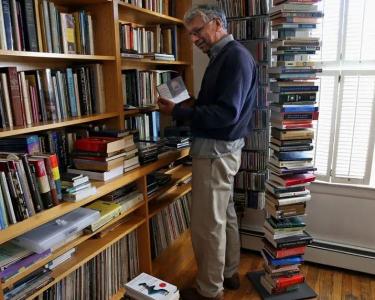 Vijay Seshadri spending time with book at his home in Brooklyn