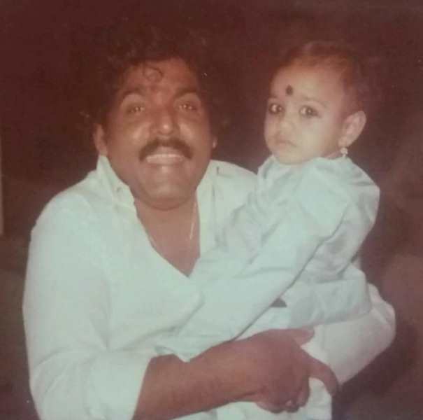 A childhood image of Prashanthini with her father