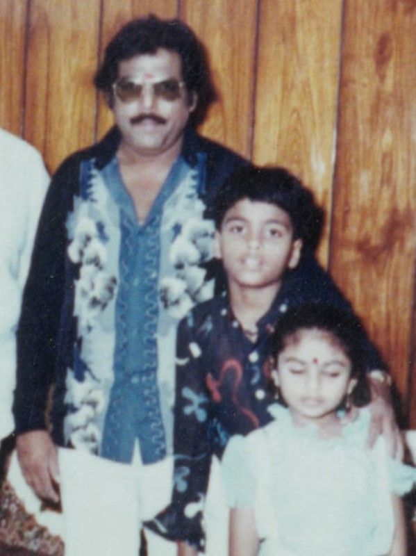 A childhood image of Yugendran with his father and sister