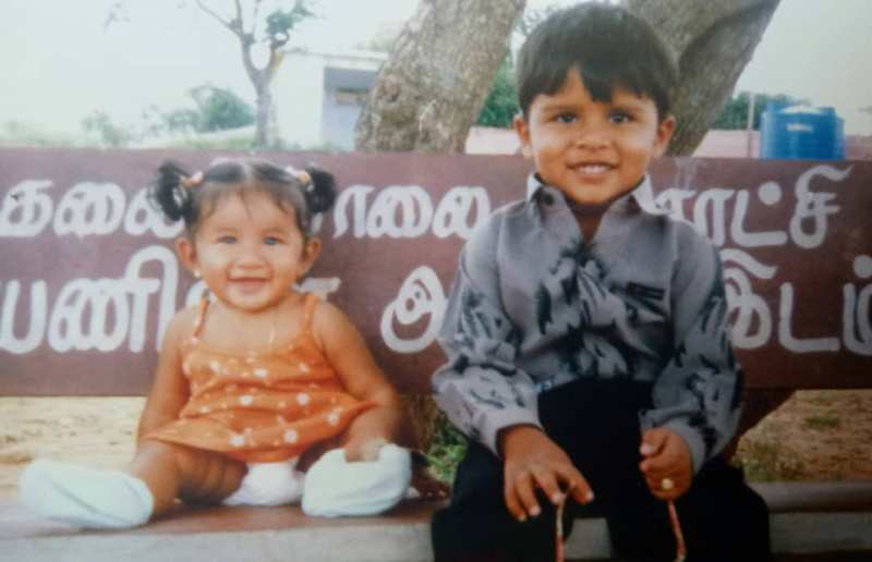 A childhood picture of Raveena Daha with her brother