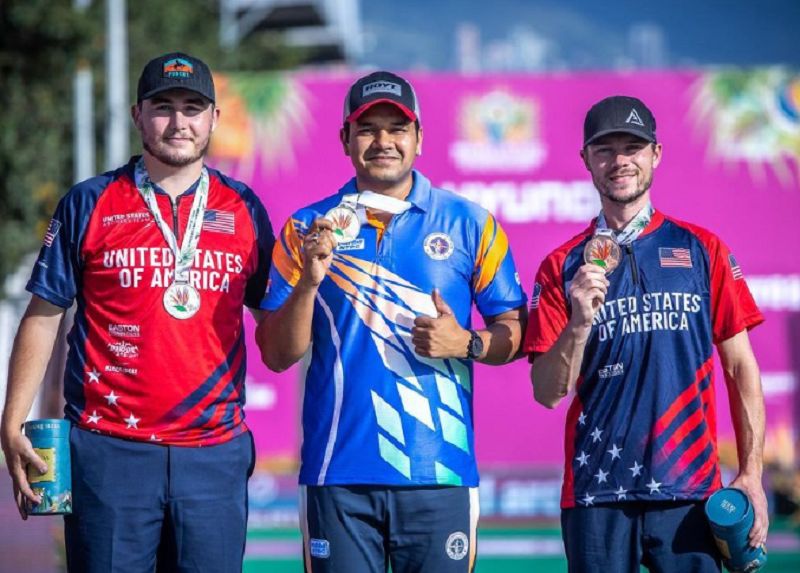 Abhishek Verma (centre) posing with gold medal in Archery World Cup 2023 at Medellin