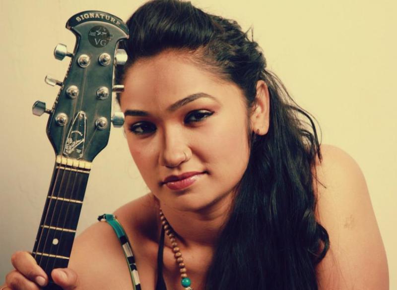 Akshatha Gowda with a guitar