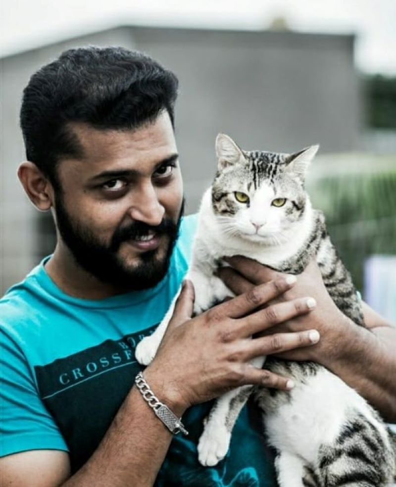 Amruth Kalam with a cat 