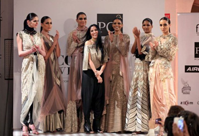Anamika Khanna (in black trousers) at the PCJ Delhi Couture Week in 2013