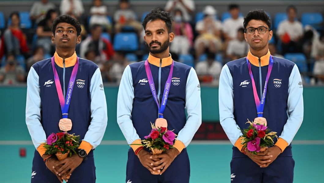 Anandkumar Velkumar (extreme left) posing with the bronze medal that he won at the 2022 Asian Games along with Siddhant Kamble and Vikram Rajendra Ingale
