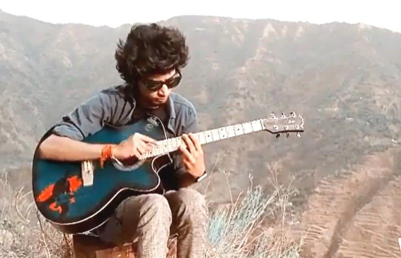 Anurag Dobhal playing guitar