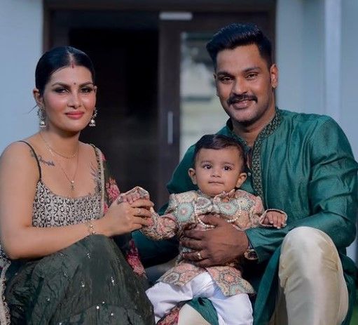 Apporva S Rao with her husband and son