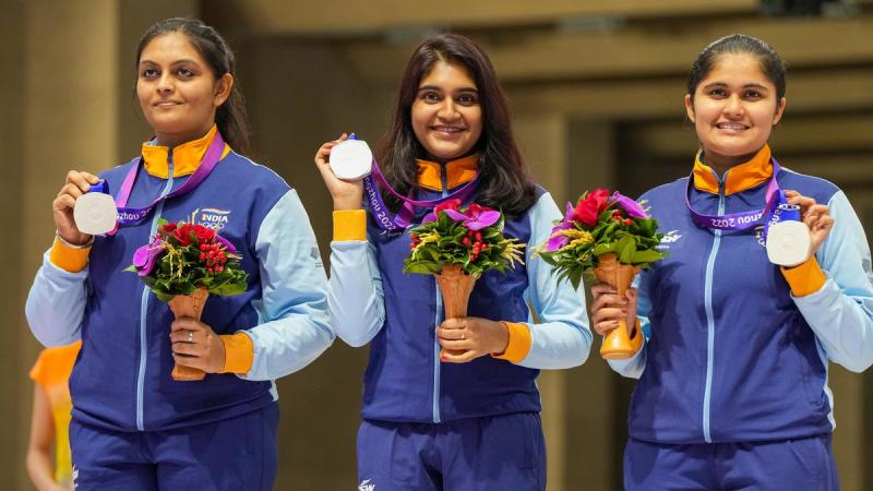 Divya receiving medal for women’s 10m air pistol team event