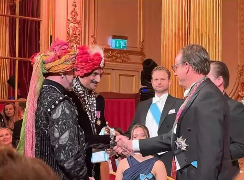 Gohil being honoured by the Swedish Royal family