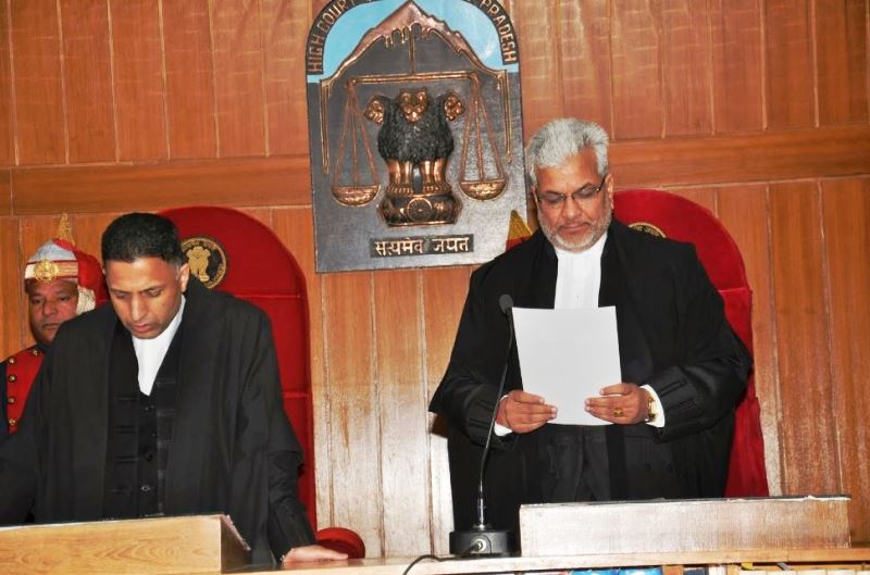 Justice Dharam Chand Chaudhary taking as the Judge of the High Court of Himachal Pradesh administered by the Acting Chief Justice Mansoor Ahmad Mir in 2014