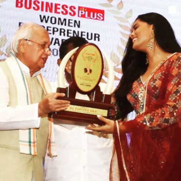 Karthika Nair while receiving the Business Women Entreprenur of th Year Award