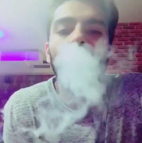 Kunal Thakur while smoking hukka