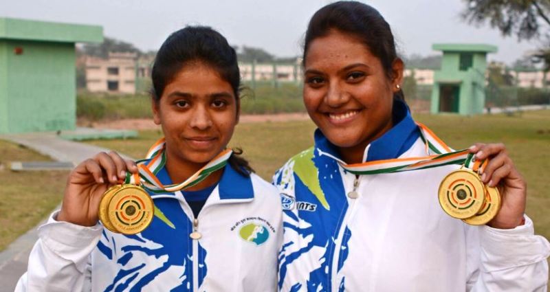 Manisha Keer (left) posing with her medals in India