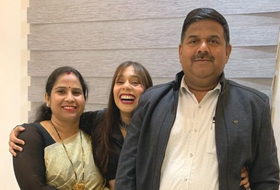 Meghana Yadav with her parents