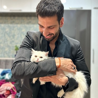 Mohit Chhikara posing with his pet cat