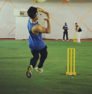 Naman Shaw while bowling during a cricket match
