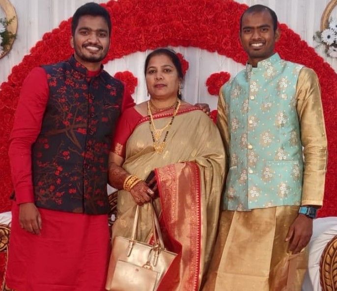 Nihal Baig with his mother and brother (left)