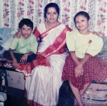 A childhood picture of Nivetha Pethuraj with her brother and mother