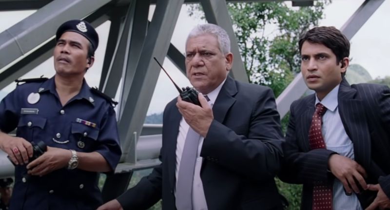 Om Puri (centre) in a still from the film 'Don- The Chase Begins Again' (2006)