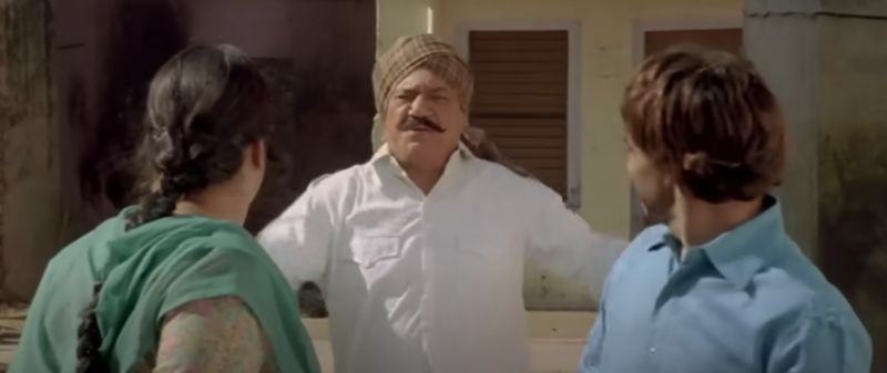 Om Puri (centre) in a still from the film 'Singh is Kinng' (2008)
