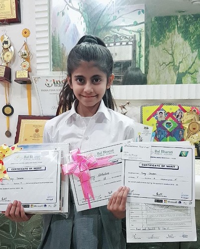 Perry Chhabra with her certificates