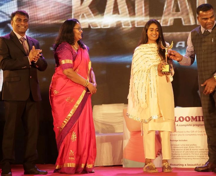Poornima Ravi (yellow suit) receiving special award by Rado Labs