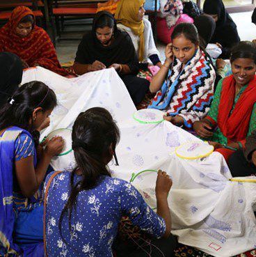 Pranjali in conversation with the artisans in India