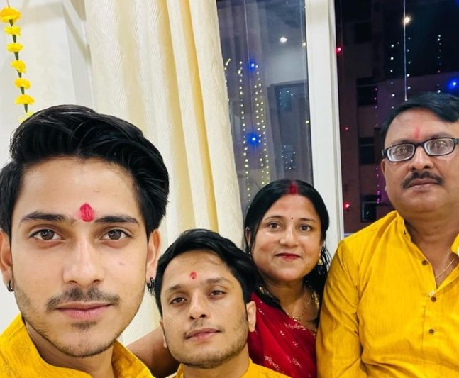Purav Jha with his parents and brother, Gaurav Jha