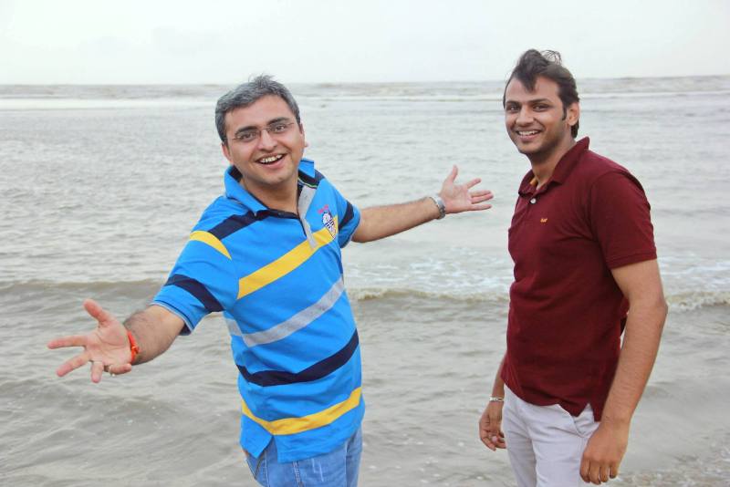 Rajat Sain (right) during a trip to a beach