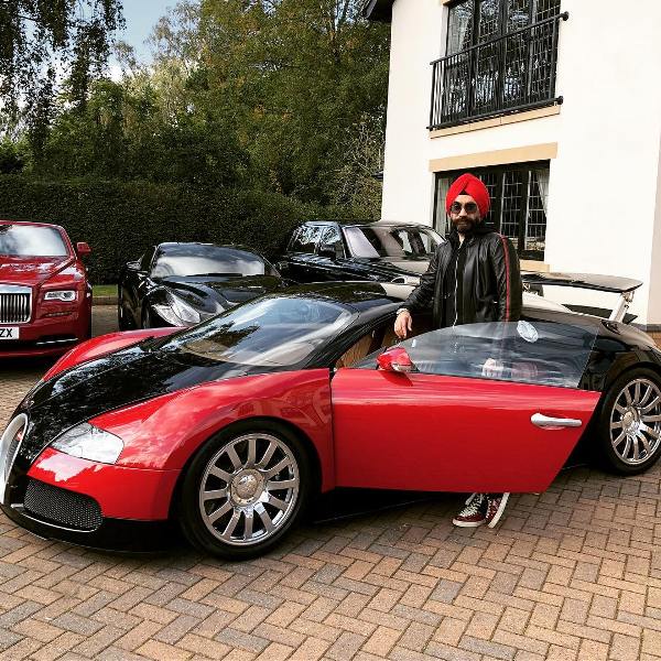 Reuben Singh posing with his Bugatti Veyron