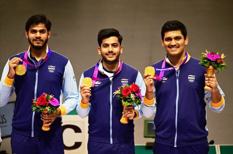 Rudrankksh Patil, Aishwary Pratap Singh Tomar, and Divyansh Singh Panwar after winning a gold medal for India in the men's team 10m air rifle at the 2022 Asian Games held in Hangzhou, China