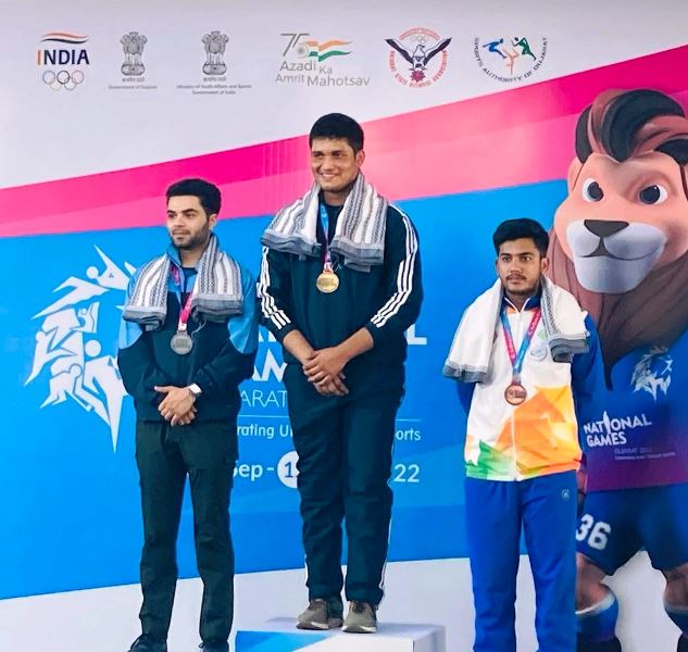 Rudrankksh Patil on the podium after clinching the gold medal in 10m air rifle at the 36th National Games of India held in Gujarat (2022)