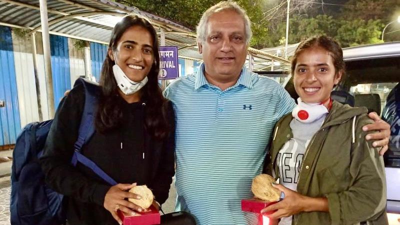 Rutuja Bhosale (left) and Ankita Raina (right) with their coach Hemant Bendrey