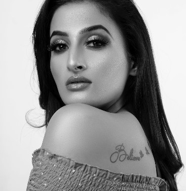 Shivani Thakur featuring a tattoo on her back
