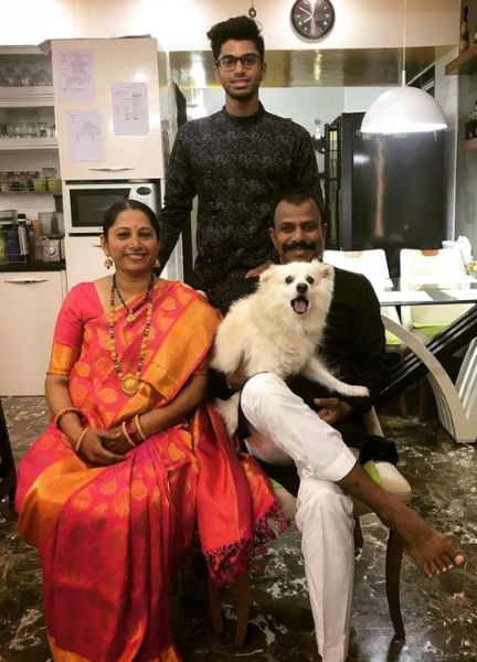 Siddhant Rahul Kamble with his parents and pet dog.