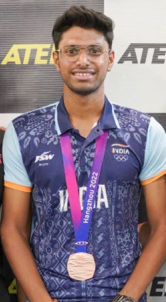Siddhant Rahul Kamble with the bronze medal that he won at the 2022 Asian Games
