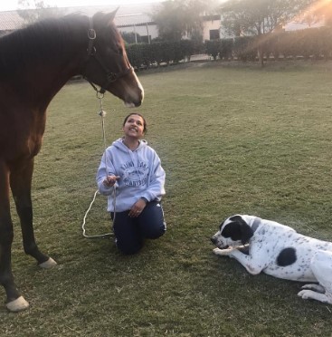Sift Kaur Samra with her pet dog and horse