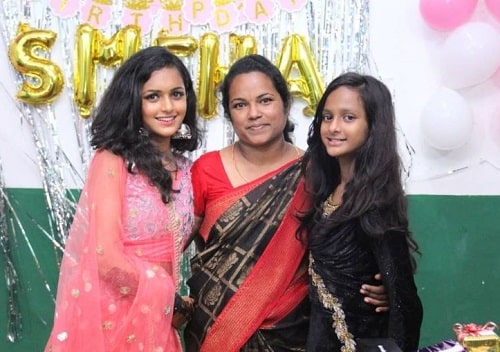 Smeha Manimegalai with her mother and sister