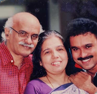 Sudheesh posing with his parents