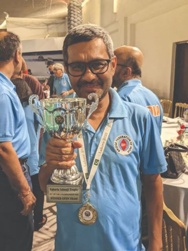 Sumit Mukherjee with the gold medal and trophy in the Bridge Federation of Asia and Middle-East Championship (BFAME) 2023