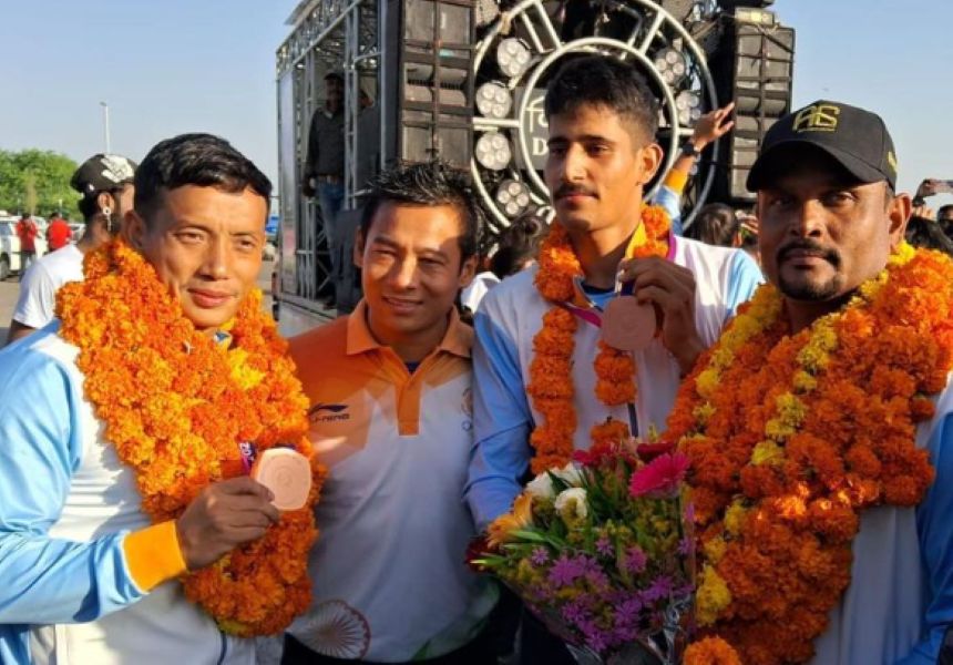 Sunil Singh Salam (extreme left) with Coach Pijush Baroi (extreme right)
