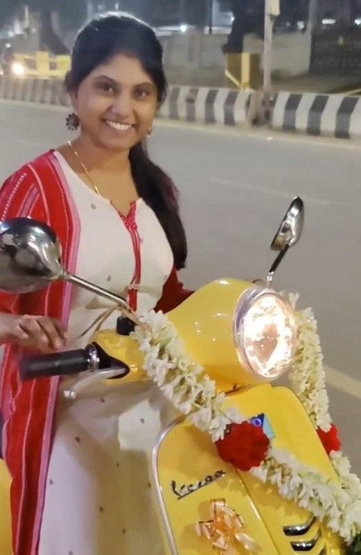 Surya with her Vespa scooter