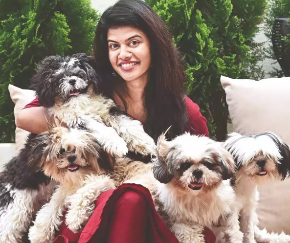 Swagatha S. Krishnan posing with her pet dogs
