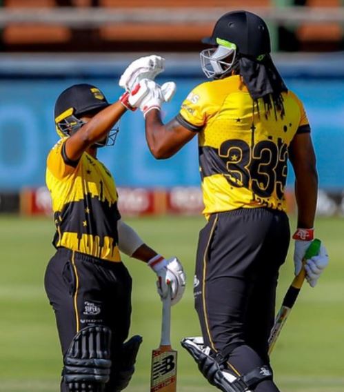 Temba Bavuma with Chris Gayle (right) during a match for the Jozi Stars