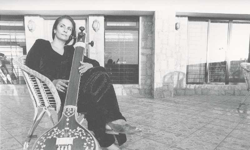 Tina Sani in her younger days, playing the Sitar