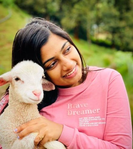 VJ Archana posing with a lamb
