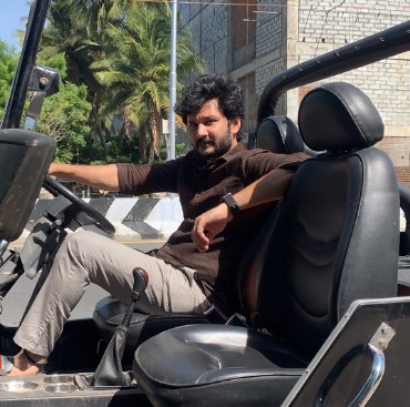 Vishnu posing with his open Jeep